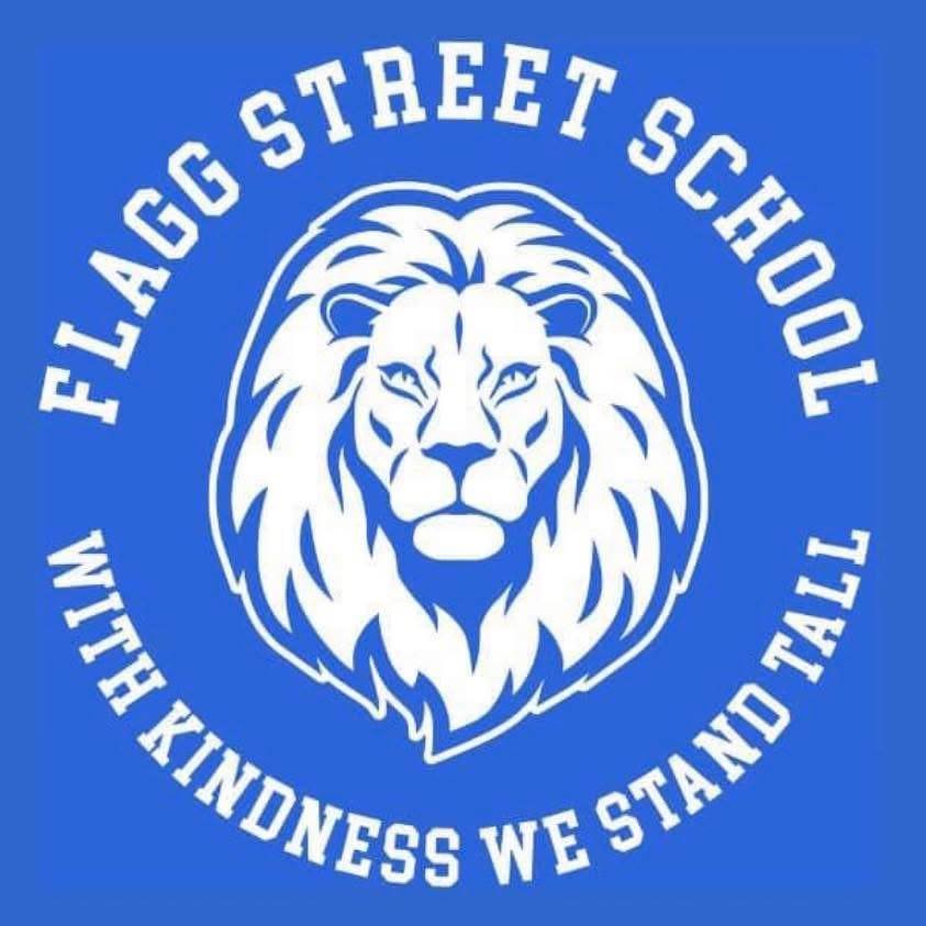 Flagg Street School crest: a lion above the words "with kindness we stand tall"